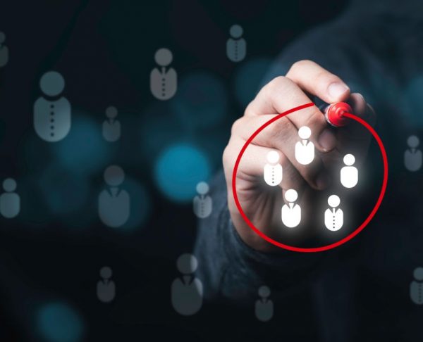 Businessman drawing red circle to marking and select human icons , Human development or marketing focus customer target group.